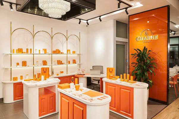 A room with orange and white furnitureAI-generated content may be incorrect.